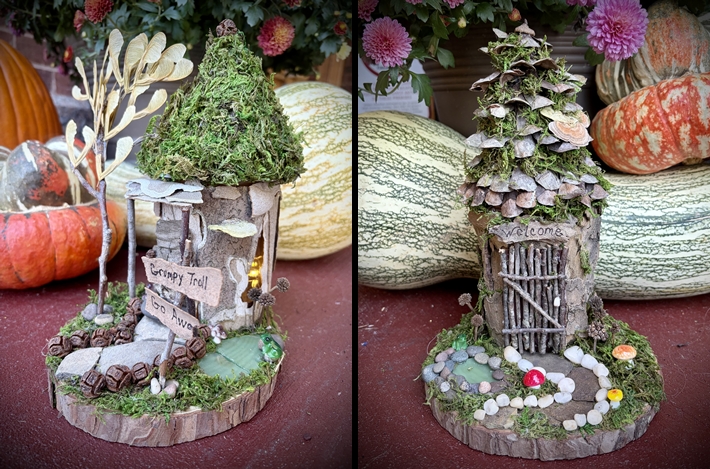 Two Mason jars covered with moss, pinecones and other natural materials setting on decorated wood slices